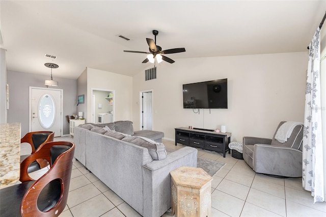 63 Walnut Crse, Ocala, FL 34480 - living area with light tile patterned floors, ceiling fan, lofted ceiling, and washer / dryer