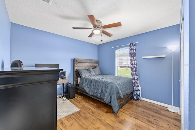 63 Walnut Crse, Ocala, FL 34480 - bedroom with wood finished floors, baseboards, and a ceiling fan