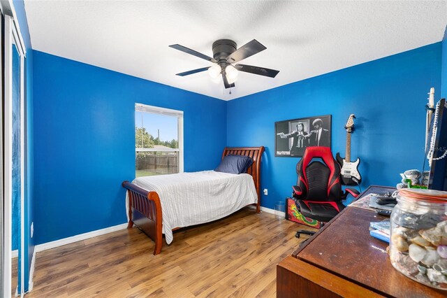 63 Walnut Crse, Ocala, FL 34480 - bedroom with wood finished floors, baseboards, and a ceiling fan