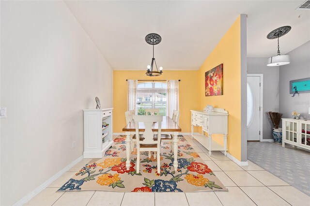 63 Walnut Crse, Ocala, FL 34480 - dining room featuring a chandelier, baseboards, light tile patterned floors, vaulted ceiling, and light colored carpet