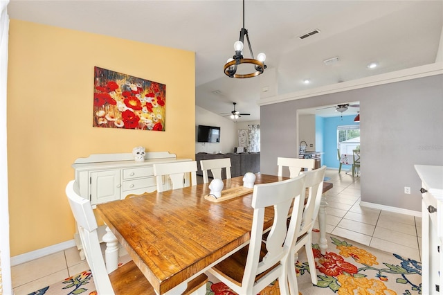 63 Walnut Crse, Ocala, FL 34480 - dining space with light tile patterned flooring, ceiling fan, a chandelier, vaulted ceiling, and baseboards