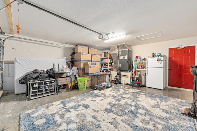 63 Walnut Crse, Ocala, FL 34480 - garage with freestanding refrigerator, heating unit, and a garage door opener