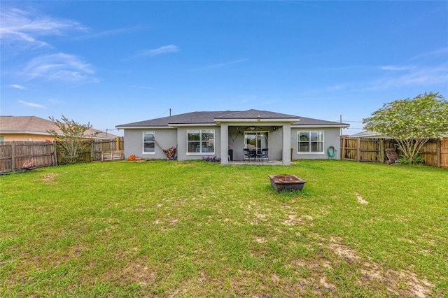63 Walnut Crse, Ocala, FL 34480 - back of property with a fire pit, ceiling fan, stucco siding, and a patio