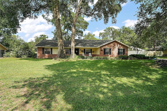 986 SE 57th Ave, Ocala, FL 34480 - ranch-style house featuring brick siding and a front yard