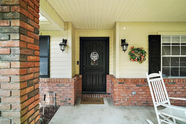986 SE 57th Ave, Ocala, FL 34480 - doorway to property featuring brick siding and a porch