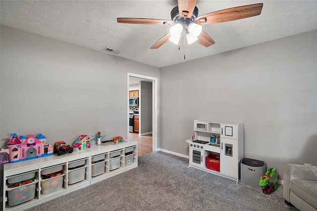 986 SE 57th Ave, Ocala, FL 34480 - game room with ceiling fan, carpet, baseboards, and a textured ceiling