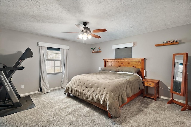 986 SE 57th Ave, Ocala, FL 34480 - bedroom featuring baseboards, carpet flooring, a ceiling fan, and a textured ceiling