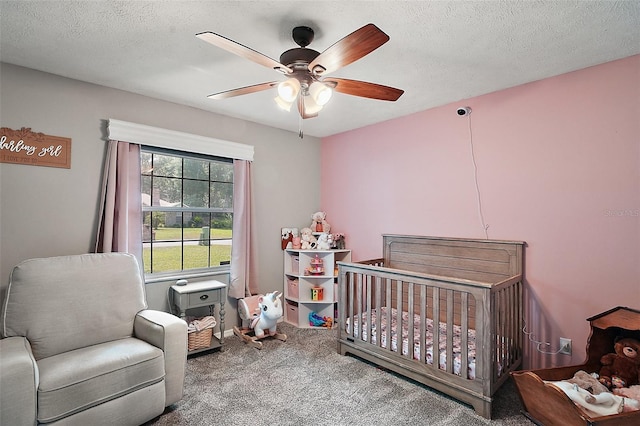 986 SE 57th Ave, Ocala, FL 34480 - carpeted bedroom with a nursery area, a ceiling fan, and a textured ceiling