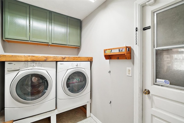 986 SE 57th Ave, Ocala, FL 34480 - laundry area with cabinet space, washer and clothes dryer, and baseboards