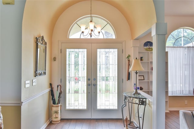 2478 NW 50th Ave, Ocala, FL 34482 - foyer featuring french doors, hardwood / wood-style floors, a chandelier, and vaulted ceiling