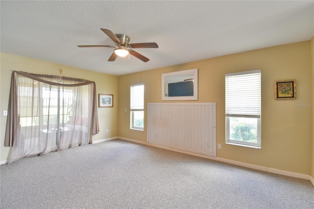 2478 NW 50th Ave, Ocala, FL 34482 - empty room featuring carpet flooring, a ceiling fan, and a textured ceiling