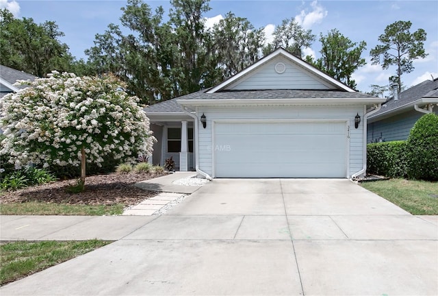 3416 NW 26th St, Gainesville, FL 32605 - ranch-style home featuring driveway and a garage