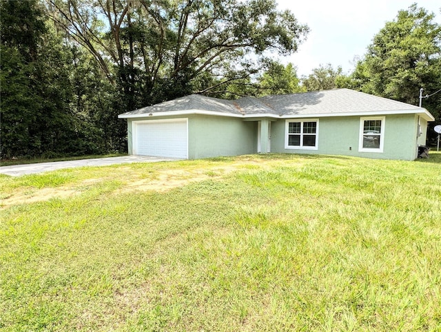 13921 SW 108th Ln, Dunnellon, FL 34432 - ranch-style house featuring a garage, driveway, a front yard, and stucco siding