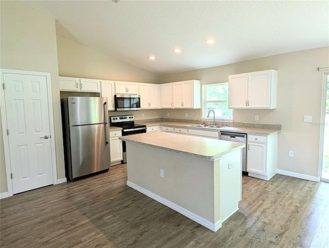 13921 SW 108th Ln, Dunnellon, FL 34432 - kitchen featuring appliances with stainless steel finishes, a sink, wood finished floors, white cabinetry, and light countertops