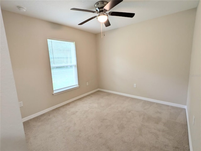 13921 SW 108th Ln, Dunnellon, FL 34432 - empty room with light colored carpet, ceiling fan, baseboards, and a smoke detector