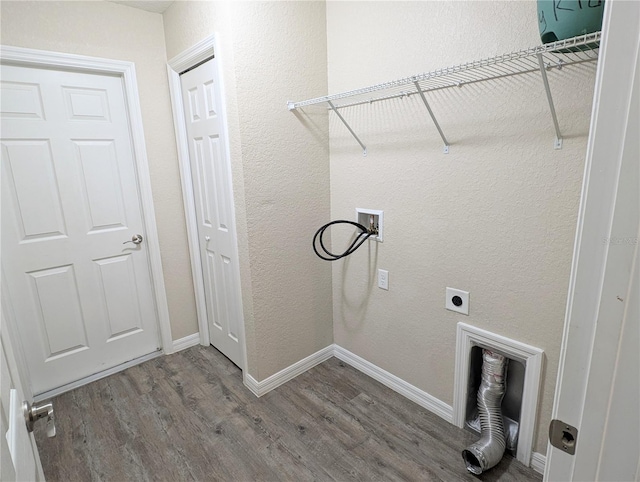 13921 SW 108th Ln, Dunnellon, FL 34432 - laundry area featuring wood finished floors, washer hookup, electric dryer hookup, baseboards, and a textured wall