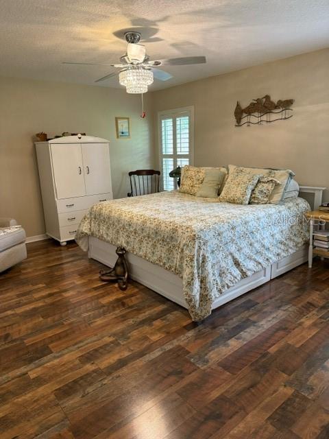 16023 SW 14th Avenue Rd, Ocala, FL 34473 - bedroom featuring dark wood finished floors and ceiling fan