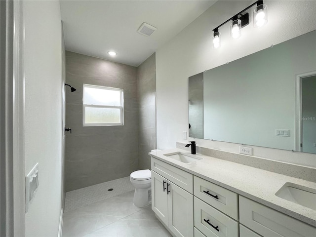 142 Guava Pass, Ocklawaha, FL 32179 - full bath with toilet, double vanity, tiled shower, and tile patterned floors