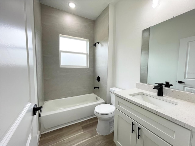 142 Guava Pass, Ocklawaha, FL 32179 - full bathroom with vanity, wood finished floors, bathtub / shower combination, and toilet