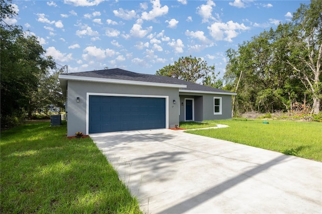75 Guava Ter, Ocklawaha, FL 32179 - ranch-style house with stucco siding, a front lawn, driveway, and a garage