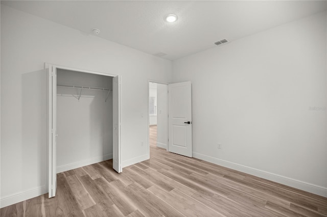 75 Guava Ter, Ocklawaha, FL 32179 - unfurnished bedroom featuring light wood finished floors, a closet, and recessed lighting