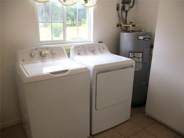 14695 SW 112th Cir, Dunnellon, FL 34432 - washroom featuring electric water heater, separate washer and dryer, and light tile patterned floors