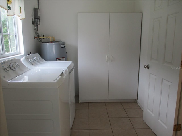 14695 SW 112th Cir, Dunnellon, FL 34432 - washroom with washer and clothes dryer, light tile patterned floors, and water heater