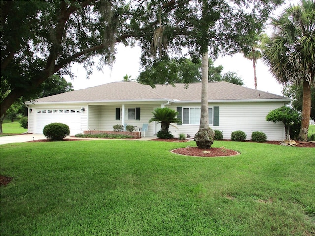 14695 SW 112th Cir, Dunnellon, FL 34432 - ranch-style house featuring a garage, concrete driveway, a front lawn, and a shingled roof