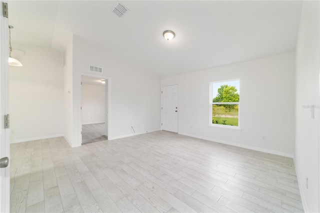 37 Teak Run, Ocala, FL 34472 - empty room with light wood-style flooring and vaulted ceiling