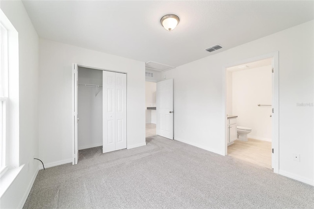 37 Teak Run, Ocala, FL 34472 - unfurnished bedroom with carpet floors, a closet, and ensuite bath