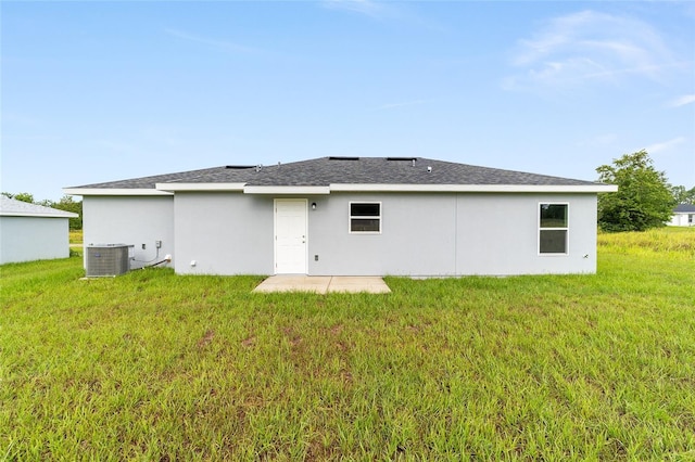37 Teak Run, Ocala, FL 34472 - rear view of house featuring a yard and stucco siding