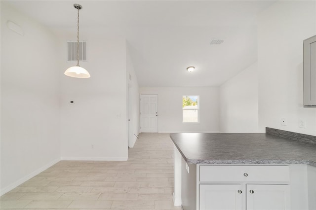 6 Locust Loop Crse, Ocala, FL 34472 - kitchen with light wood finished floors, a peninsula, white cabinets, hanging light fixtures, and open floor plan