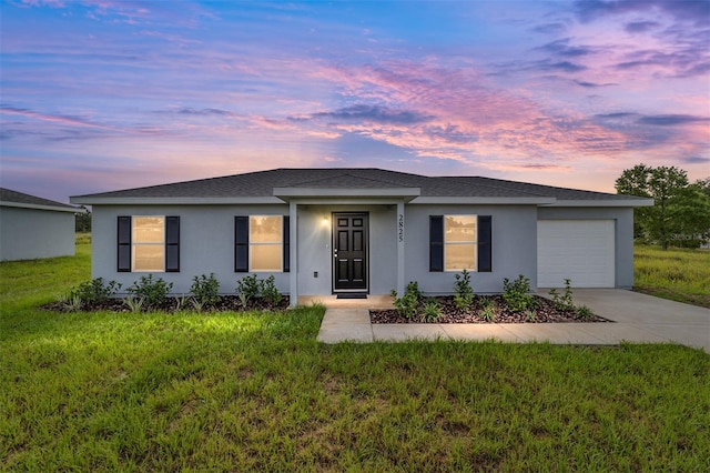 14690 SW 24th Pl, Ocala, FL 34481 - ranch-style house with an attached garage, concrete driveway, stucco siding, a front lawn, and roof with shingles