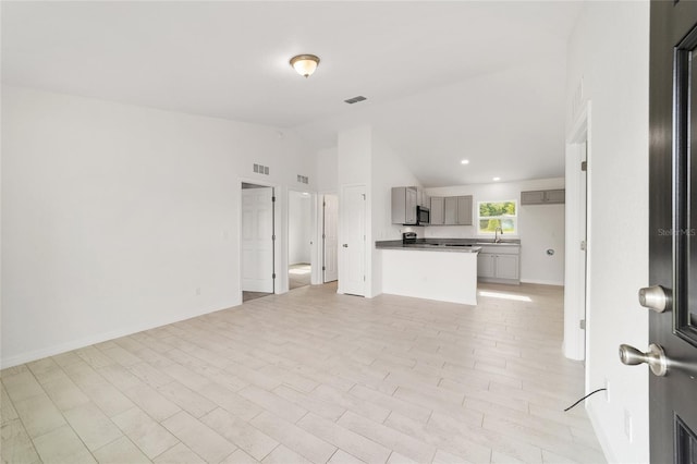 14690 SW 24th Pl, Ocala, FL 34481 - unfurnished living room with vaulted ceiling and recessed lighting