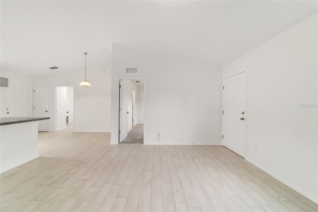 14690 SW 24th Pl, Ocala, FL 34481 - unfurnished living room featuring vaulted ceiling and light wood finished floors