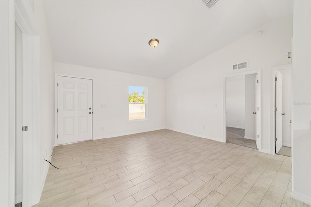 14690 SW 24th Pl, Ocala, FL 34481 - spare room featuring lofted ceiling and light wood-style flooring
