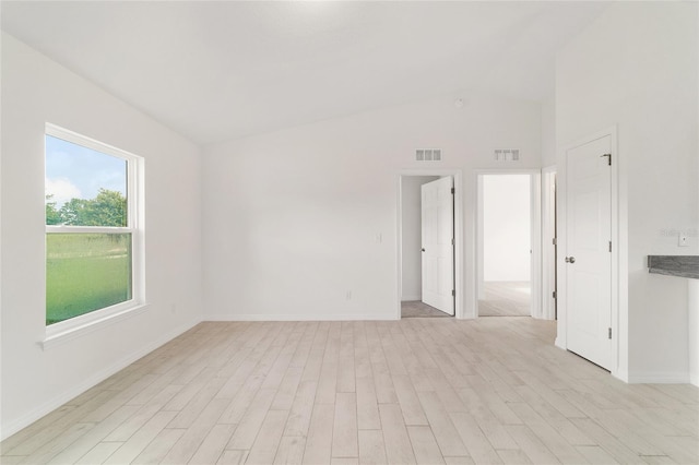 14690 SW 24th Pl, Ocala, FL 34481 - unfurnished room with light wood finished floors and vaulted ceiling