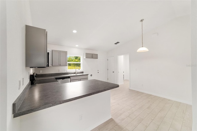 14690 SW 24th Pl, Ocala, FL 34481 - kitchen with stove, dark countertops, a peninsula, lofted ceiling, and dishwasher