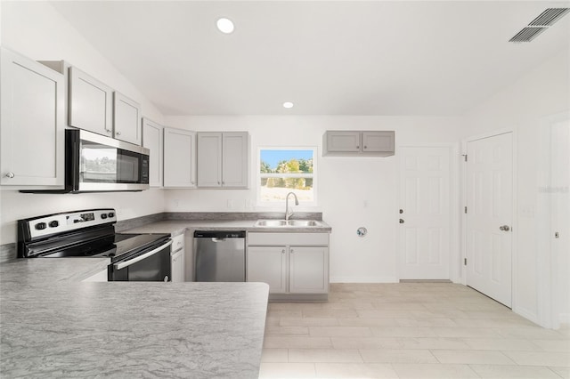 14690 SW 24th Pl, Ocala, FL 34481 - kitchen featuring appliances with stainless steel finishes, gray cabinets, and recessed lighting
