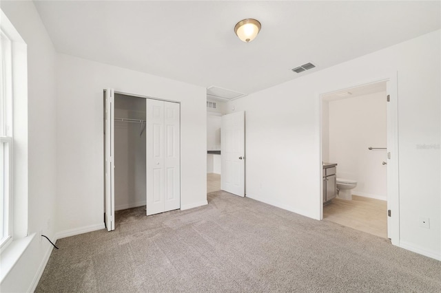 14690 SW 24th Pl, Ocala, FL 34481 - unfurnished bedroom with carpet flooring, a closet, and ensuite bathroom