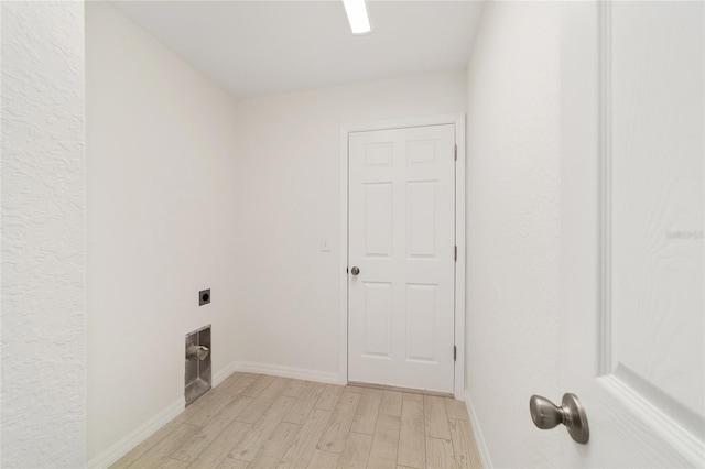 14690 SW 24th Pl, Ocala, FL 34481 - laundry area featuring electric dryer hookup and light wood-style flooring