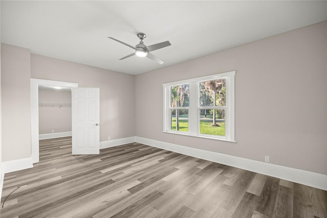 4609 NE 7th St, Ocala, FL 34470 - empty room with a ceiling fan and wood finished floors