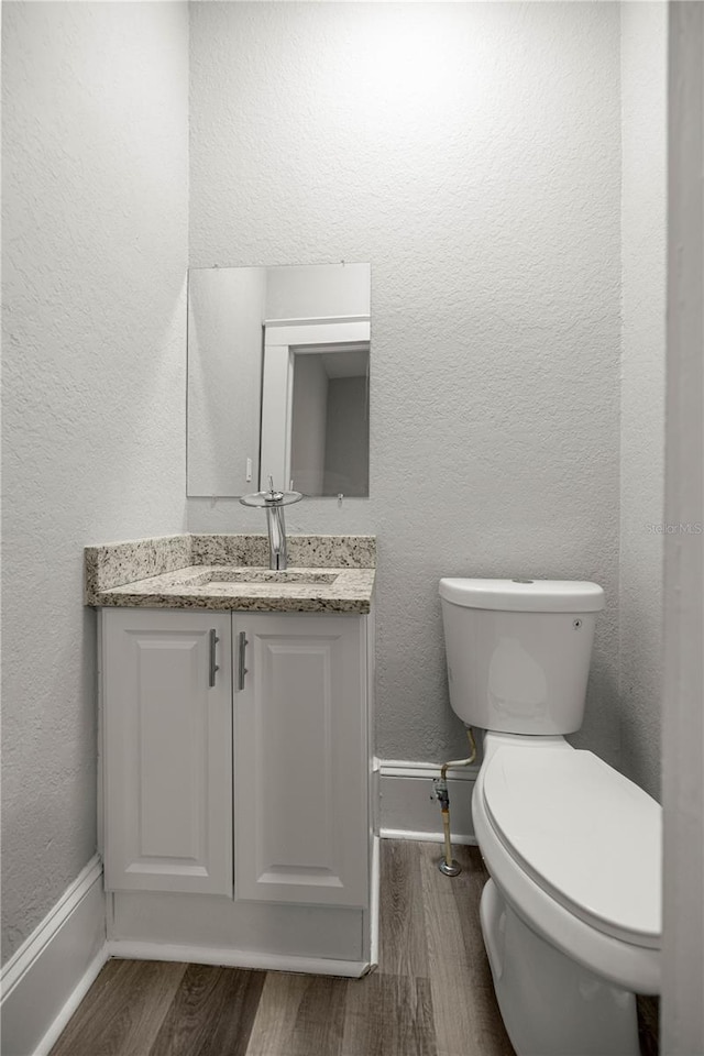 4609 NE 7th St, Ocala, FL 34470 - bathroom featuring wood finished floors and vanity