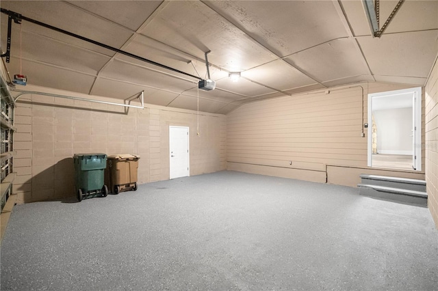 4609 NE 7th St, Ocala, FL 34470 - garage featuring concrete block wall and a garage door opener