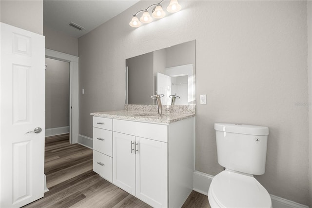 4609 NE 7th St, Ocala, FL 34470 - bathroom with vanity and wood finished floors