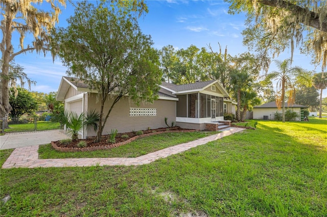 4609 NE 7th St, Ocala, FL 34470 - view of side of home featuring a sunroom, a garage, driveway, and stucco siding