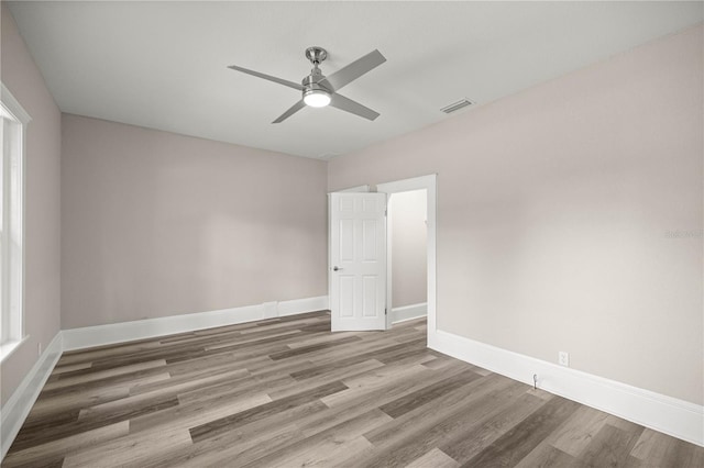 4609 NE 7th St, Ocala, FL 34470 - empty room with wood finished floors and ceiling fan