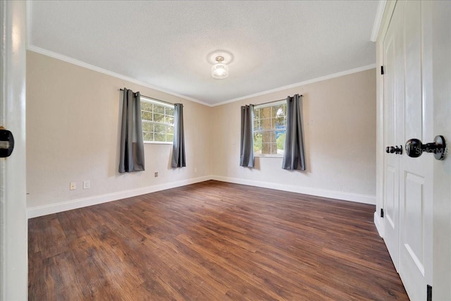 6511 SE 25th Ave, Ocala, FL 34480 - spare room featuring dark wood-type flooring, baseboards, crown molding, and a textured ceiling