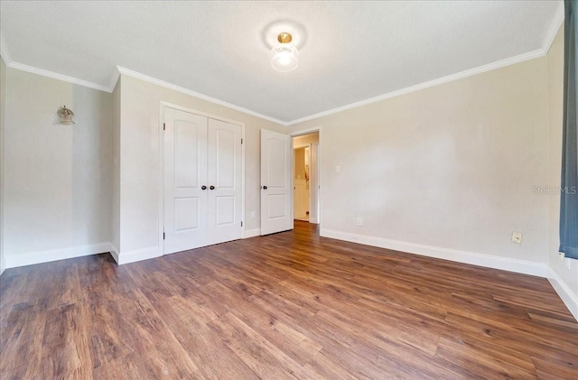 6511 SE 25th Ave, Ocala, FL 34480 - unfurnished bedroom featuring wood finished floors, baseboards, ornamental molding, and a closet