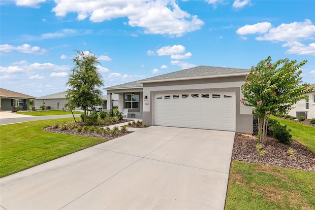 8802 SW 79th Loop, Ocala, FL 34481 - view of front of house with stucco siding, a front lawn, and a garage